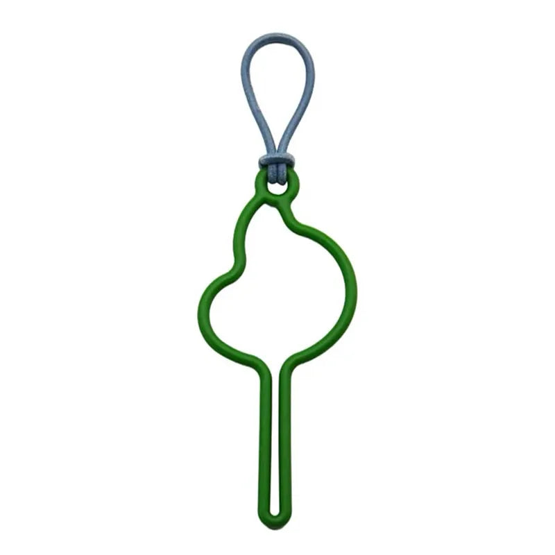 A green hands-free dog poop bag dispenser with a gray leash clip.
