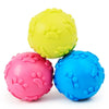 A bright yellow squeaky chew toy shaped like a paw print for dogs.