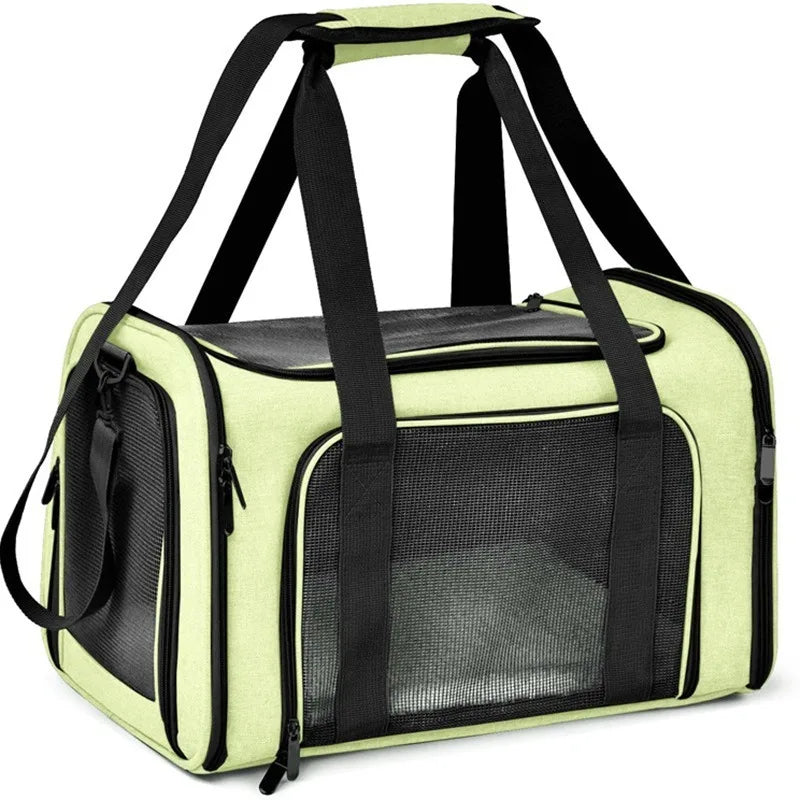 A lime green portable pet carrier bag with black straps and a mesh window.