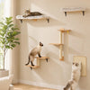 A wall-mounted cat climbing set featuring multiple modular wooden shelves and a soft cat bed on a beige wall.