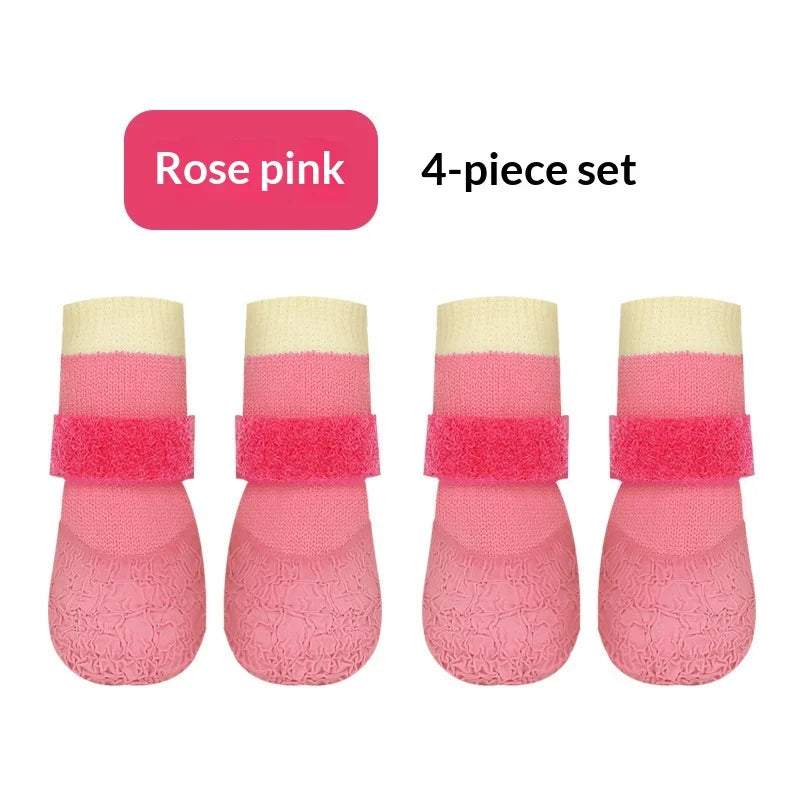 A 4-piece set of rose pink waterproof anti-slip dog boots for small breeds.