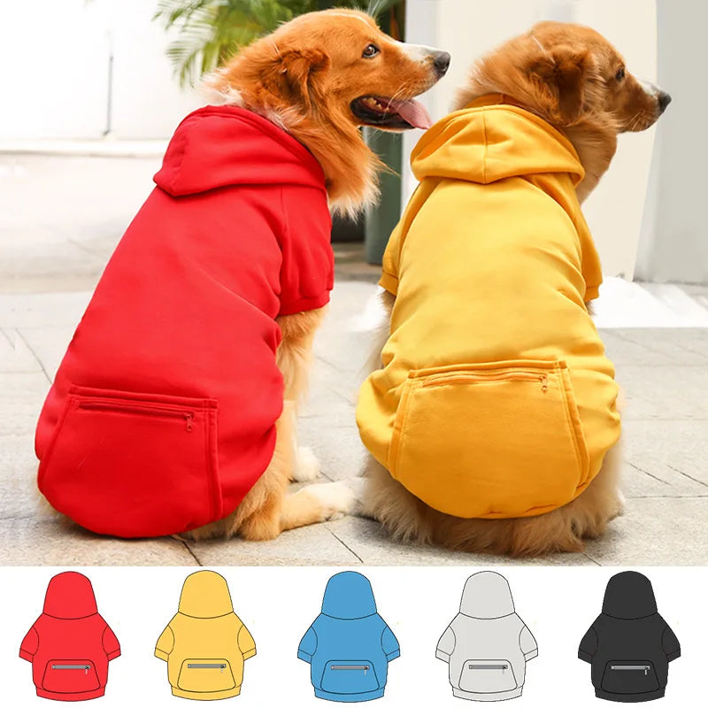 A collection of reversible pet jackets for dogs in red, yellow, blue, and gray.
