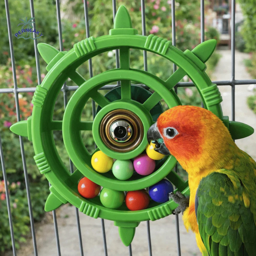 A vibrant green interactive parrot spinner rattle toy with colorful balls inside, viewed through a wire cage.