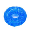 A close-up view of a bright blue spiky squeaky dog chew toy for dental care.