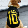 A golden retriever wearing a black football jersey with the word BRAZIL and the number 10 on its back.