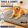 A golden retriever lies on a gray dog mat, demonstrating thick support and comfort.