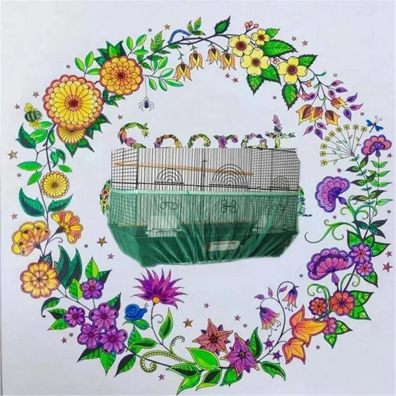 A bird cage seed catcher skirt made of nylon mesh with a green fabric base and decorative floral greenery.