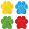 A set of silicone pet licking mats in yellow, blue, green, and red with suction cups for dogs and cats