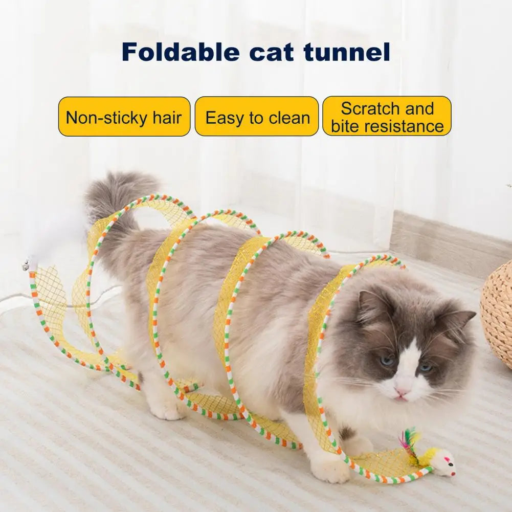 A fluffy gray and white cat is playing inside a yellow foldable cat tunnel for indoor play.