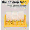 A yellow puzzle dispenser with three white food blocks and scattered dog treats.