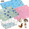 Two reusable absorbent pet pee pads and a wire pet enclosure are shown.