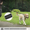 A dog is walking on a leash, demonstrating the shock absorbing bungee feature of a tactical dog leash.