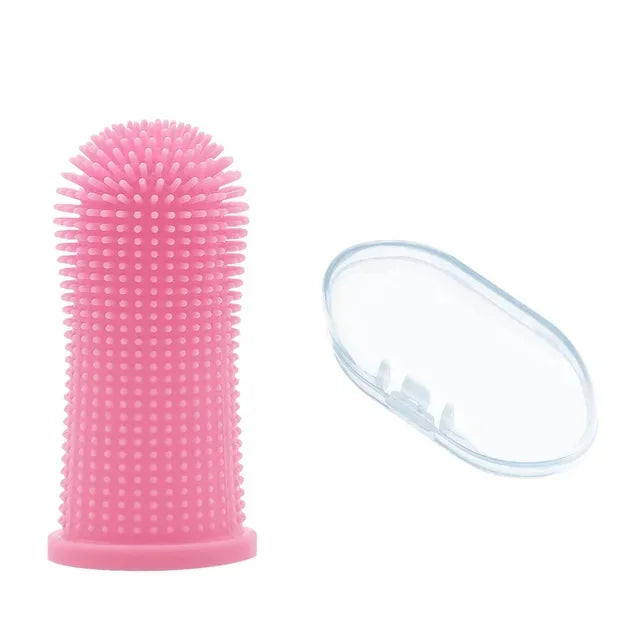 A pink silicone pet toothbrush with bristles and a clear plastic cap.