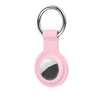 Pink silicone protective cover for an AirTag with a metal keychain ring.
