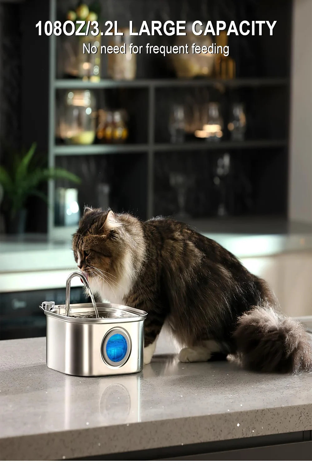 A tabby cat is drinking water from a stainless steel pet water fountain with a blue visual window.