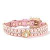 Collier pour chien et chat en perles artificielles roses avec strass clairs et fermoir doré.