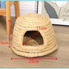 A natural straw woven mat shaped like a dome with an entrance for small rodents.