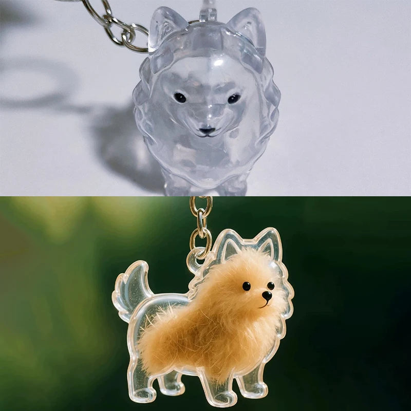 Klares Acryl-Anhänger mit einer kleinen, flauschigen Welpefigur an einem Metallring.