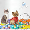 A tabby cat and a small terrier dog sitting next to colorful training buttons for pet communication.