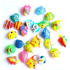 A collection of ten colorful, lifelike floating artificial tropical fish in various shades of blue, yellow, and orange.