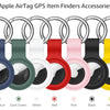 A row of silicone AirTag protective covers in various colors including dark blue, dark green, white, red, pink, black, and ye