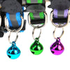 A reflective cat collar with a breakaway buckle and bell featuring colorful, shiny charms.