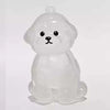 Figura de perro de cartón transparente y translúcido, con forma de perro sentado, utilizada como llavero para guardar el pelo