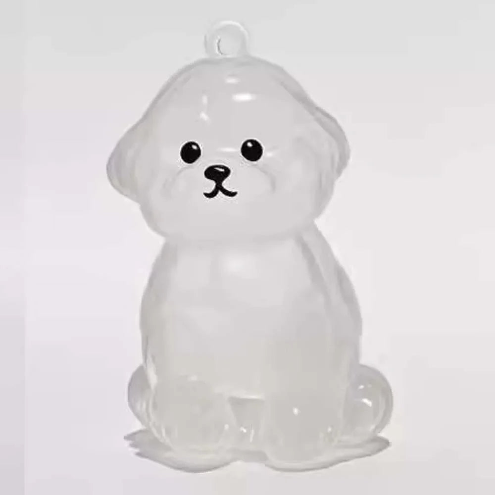 Figura de perro de cartón transparente y translúcido, con forma de perro sentado, utilizada como llavero para guardar el pelo
