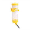 A yellow hanging drinker bottle for small pets with a clear plastic chamber and a metal tip.