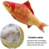 A plush toy shaped like a red and yellow fish with textured scales.