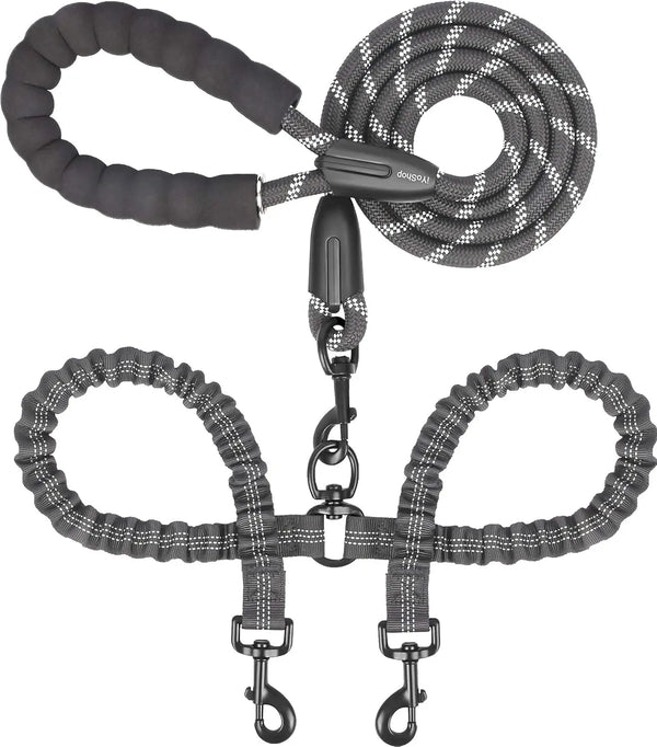 A black dual dog leash with shock absorbing bungee for two dogs, featuring a handle and multiple clips.