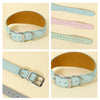 Various styles of wide leather dog collars in light blue, pink, and natural tan leather.