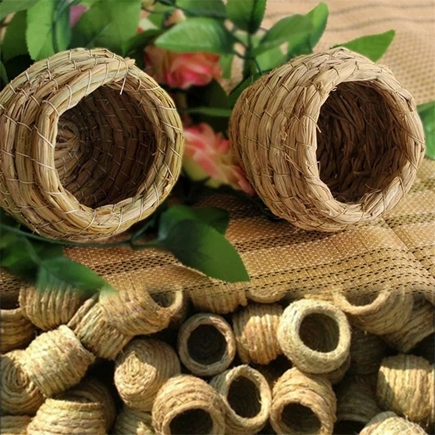 Natural straw bird nests for pet avians displayed on burlap fabric.