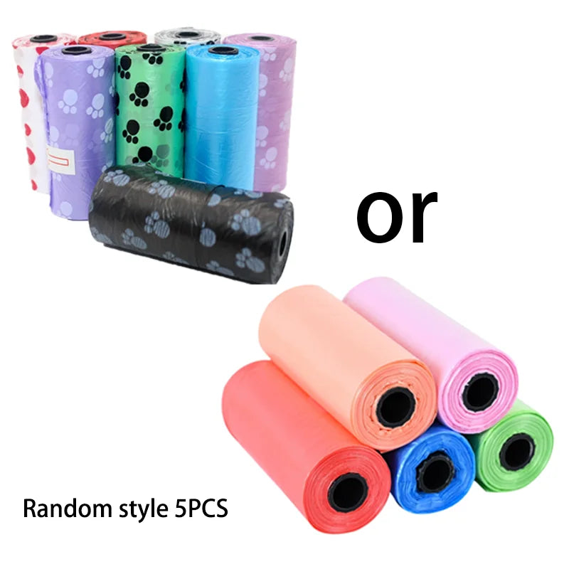 A collection of five colorful plastic litter scoops or poop pick-up tools in various colors and patterns.