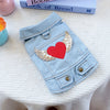 Light blue denim jacket for dogs featuring a red heart and gold feather embroidery