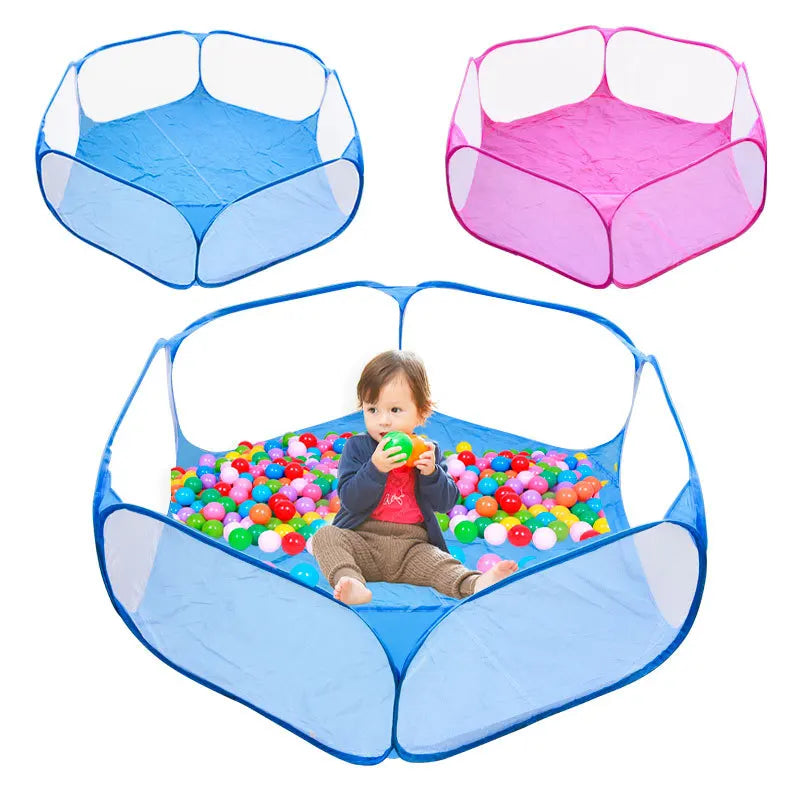 A foldable transparent pet playpen with pink and blue sections, shown assembled and in use by a child.