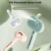 A pet pressurized spray comb in light blue and pink colors shown with a brush head and a grooming tool.
