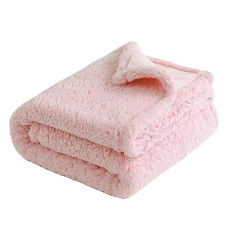 Pink cozy waterproof microfiber blanket folded neatly