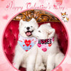 Two white fluffy dogs wearing heart-patterned bandanas celebrating Valentine's Day