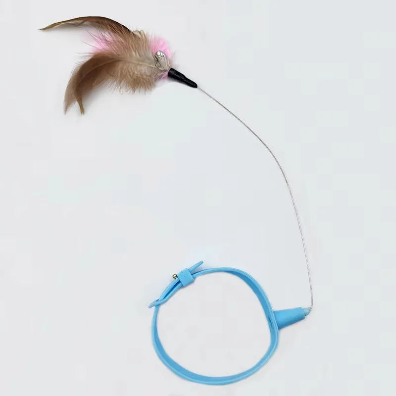A feather cat teaser wand with a brown and pink feather and a blue handle.