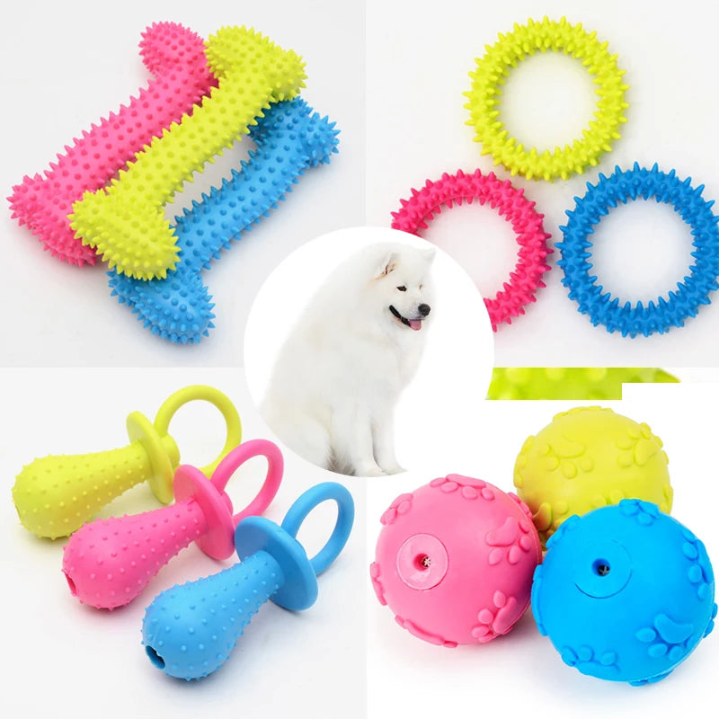 Assortment of colorful squeaky chew toys for dogs including pink, yellow, blue, and green rubber toys.