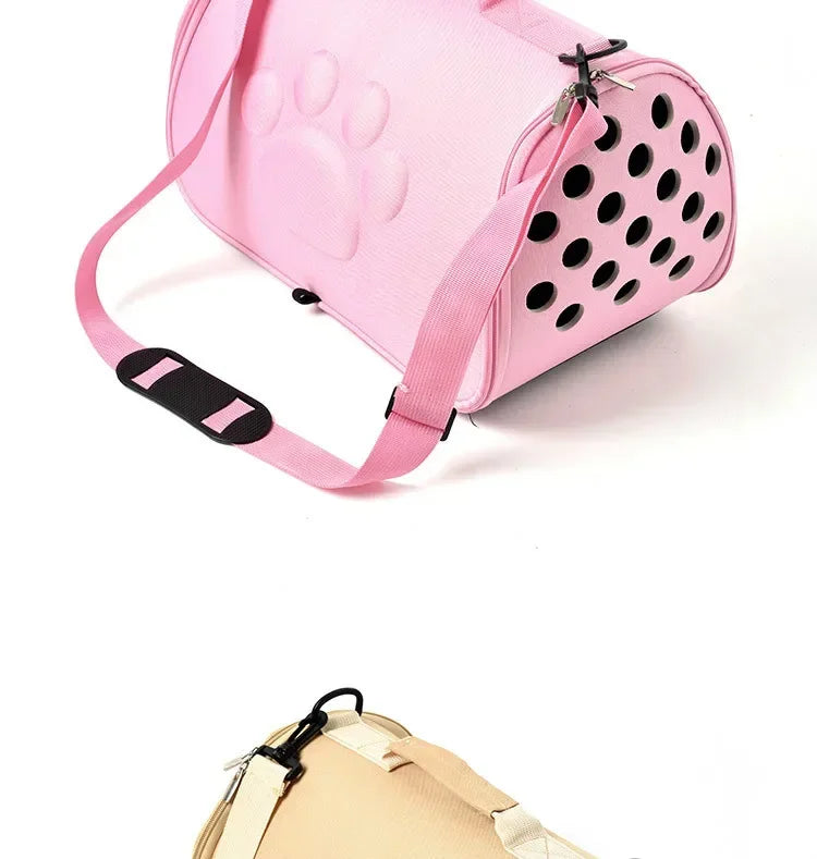 Pink breathable pet carrier bag for cats and small dogs with paw print design