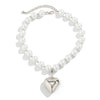 A white pearl choker necklace featuring a heart-shaped pendant.