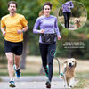 A woman is shown using a hands-free reflective dog leash with a storage bag to walk a dog.