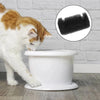 A white cat is looking at a white pet water fountain, with an inset showing black sponge replacement filters.
