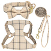 A beige plaid dog collar, harness, and leash set featuring a bowtie.