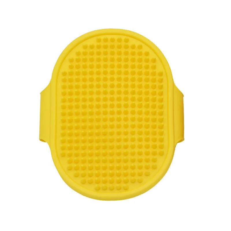 Yellow soft rubber pet grooming brush with a textured surface for dogs and cats