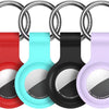 Silicone AirTag protective cover in red, cyan, black, and purple colors with a metal keychain ring.