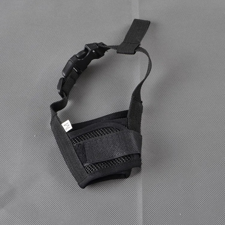 Black adjustable breathable dog muzzle with soft padding shown against a gray background.