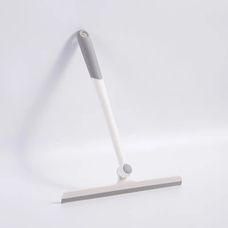 A white and gray 360° rotating shower squeegee with a silicone holder mounted on a flat base.